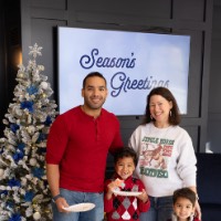 Family poses with cookies